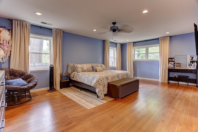bedroom featuring light wood-type flooring, recessed lighting, baseboards, and visible vents