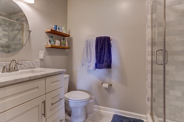 full bathroom featuring vanity, tile patterned floors, toilet, and a shower stall