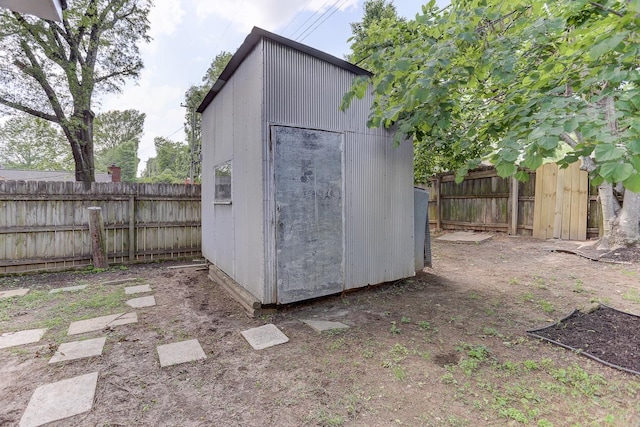 view of shed with a fenced backyard