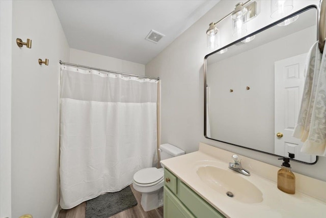 9842 Garden Pl, Collierville, TN 38139 - full bathroom featuring visible vents, curtained shower, wood finished floors, vanity, and toilet