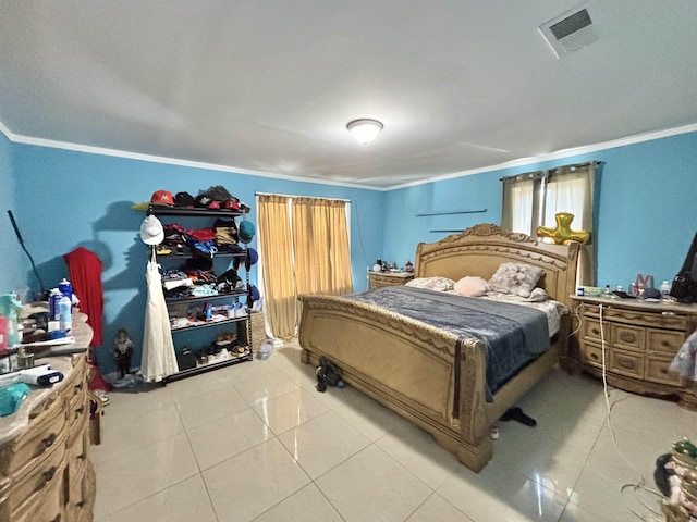 bedroom featuring crown molding, tile patterned flooring, and visible vents