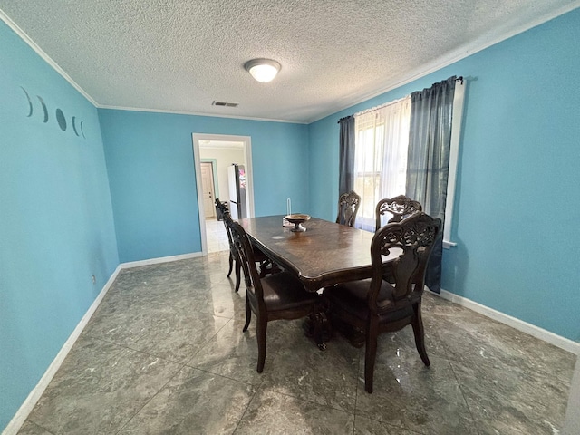 dining space with crown molding, baseboards, a textured ceiling, and visible vents
