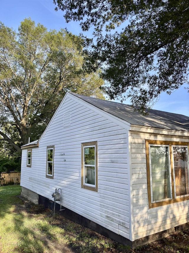 view of side of home featuring crawl space