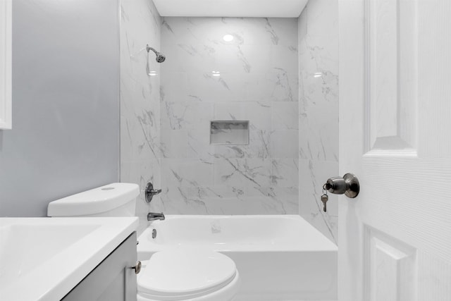 full bathroom featuring toilet, washtub / shower combination, and vanity