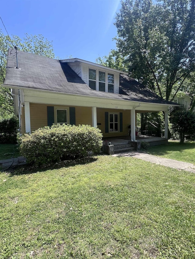 110 Shelton St, Covington, TN 38019 - view of front of property featuring covered porch and a front lawn