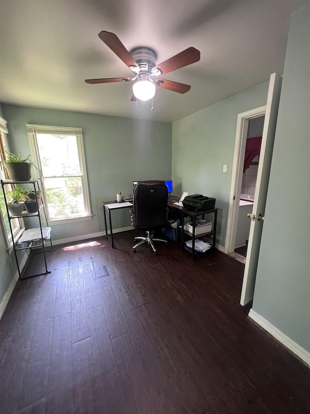 110 Shelton St, Covington, TN 38019 - office area with baseboards and dark wood finished floors