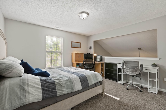 bedroom featuring baseboards, carpet, a textured ceiling, and visible vents