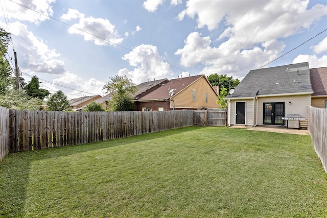 view of yard with a patio and a fenced backyard