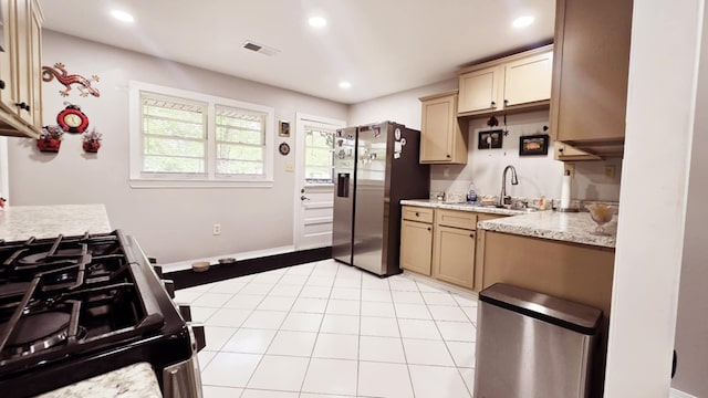 kitchen with visible vents, appliances with stainless steel finishes, a sink, light tile patterned floors, and recessed lighting