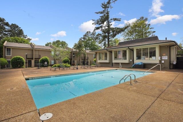 pool with a patio area