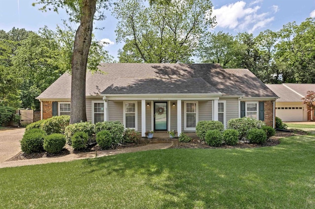 2211 Burfordi Ln, Germantown, TN 38138 - view of front of home featuring brick siding, fence, a shingled roof, and a front lawn