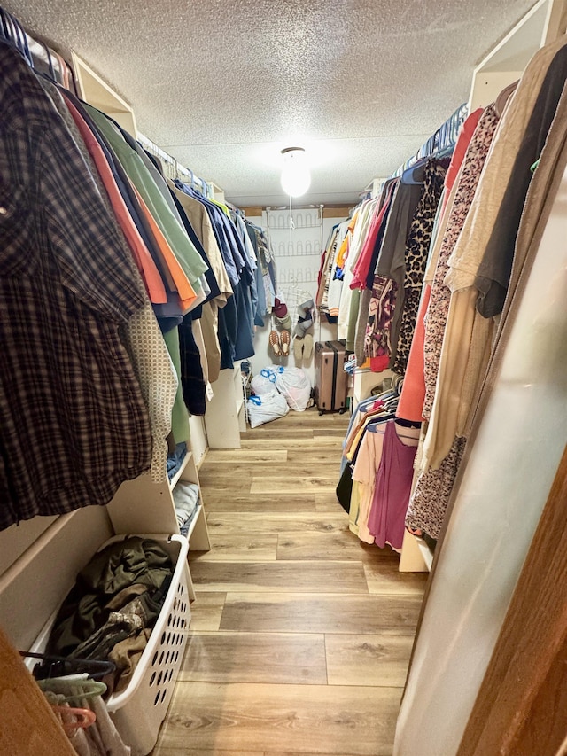spacious closet with light wood-style floors