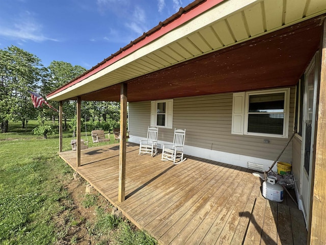 deck featuring a lawn