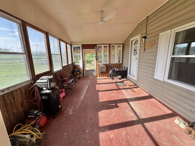 sunroom / solarium with plenty of natural light and ceiling fan