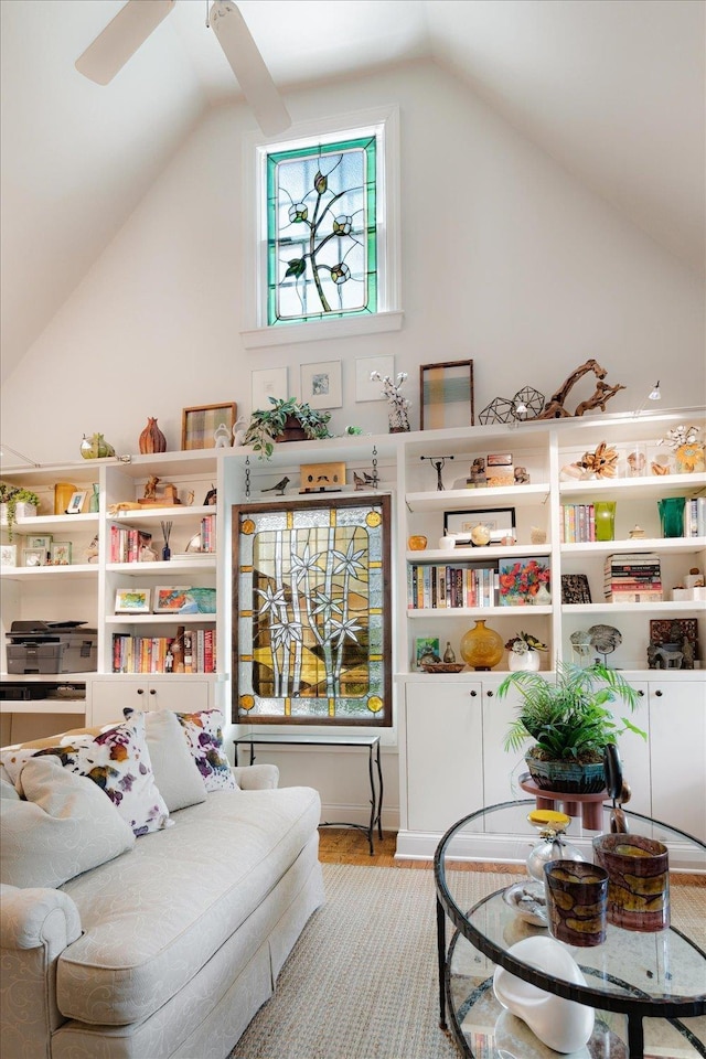 playroom featuring wood finished floors, a ceiling fan, and lofted ceiling