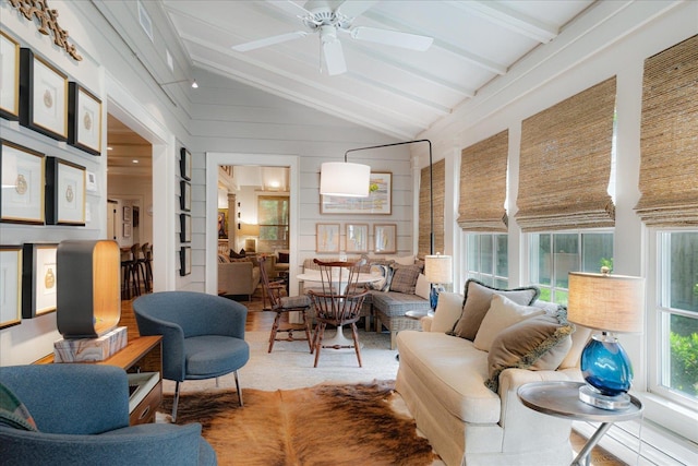 sunroom featuring beam ceiling