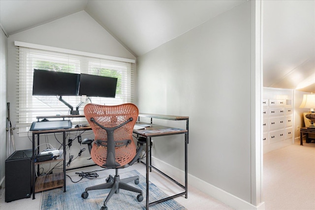 office space with baseboards, carpet flooring, and lofted ceiling