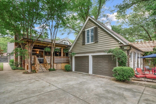 exterior space with driveway and a chimney