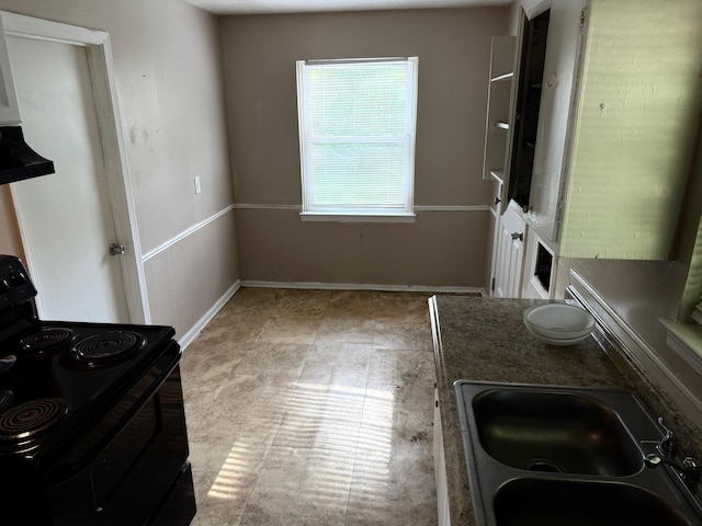 full bathroom with double vanity, a sink, and baseboards