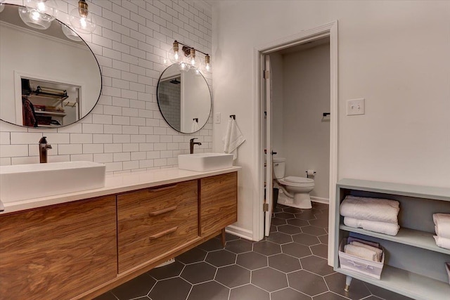 2178 E Glenalden Dr, Germantown, TN 38139 - full bathroom featuring a sink, tile patterned floors, toilet, and double vanity