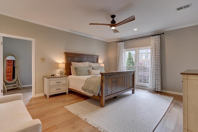 2178 E Glenalden Dr, Germantown, TN 38139 - bedroom featuring baseboards, ornamental molding, light wood-type flooring, and visible vents