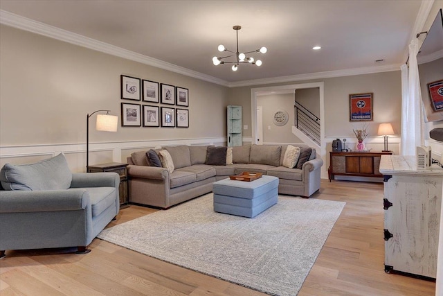 2178 E Glenalden Dr, Germantown, TN 38139 - living room featuring an inviting chandelier, ornamental molding, and light wood-style flooring