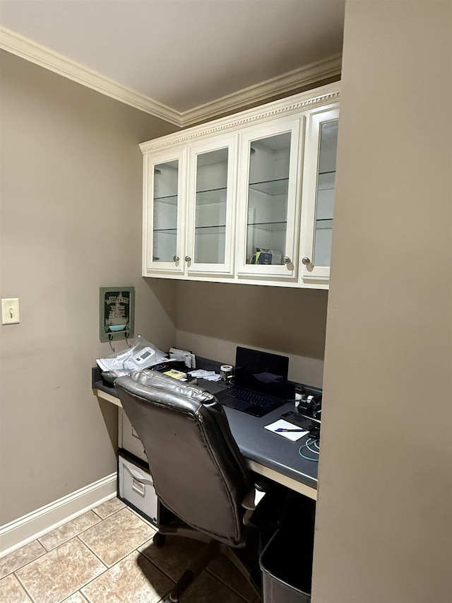 office area featuring crown molding, light tile patterned flooring, and baseboards