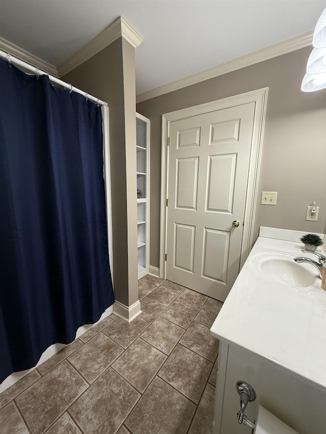 full bath with ornamental molding, tile patterned flooring, and vanity