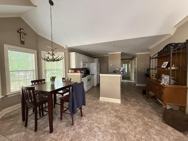 dining area featuring crown molding, baseboards, an inviting chandelier, and vaulted ceiling
