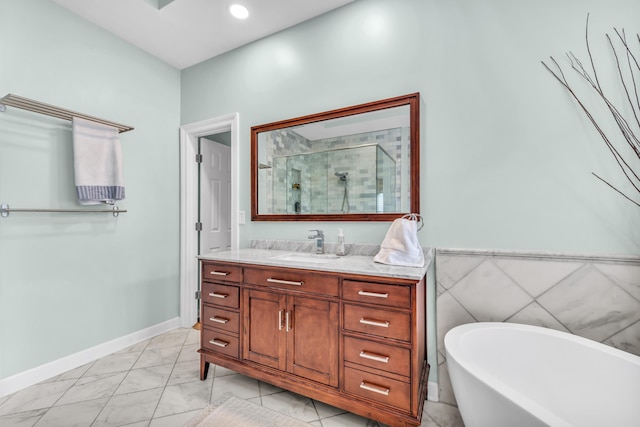 bathroom featuring a freestanding bath, vanity, a stall shower, and marble finish floor