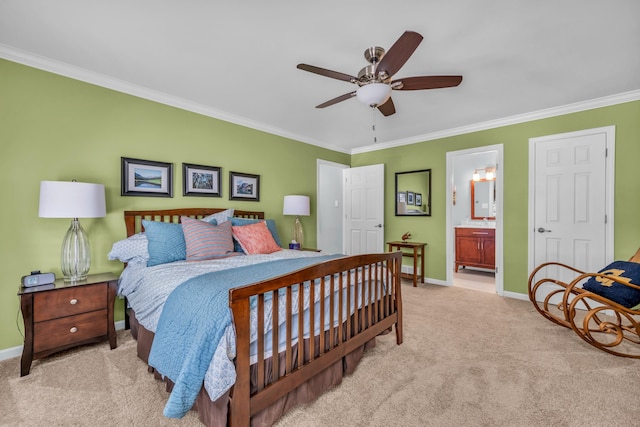bedroom featuring carpet floors, baseboards, ornamental molding, and connected bathroom