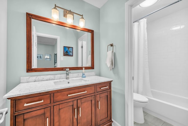full bathroom with vanity, shower / bath combination with curtain, toilet, baseboards, and tile patterned floors