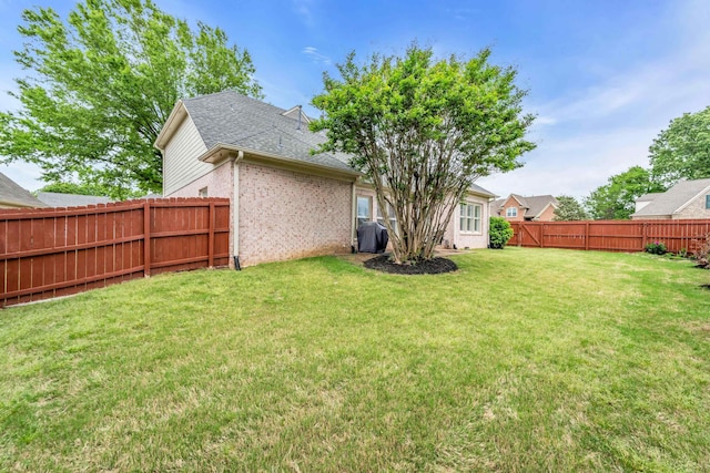 view of yard featuring a fenced backyard