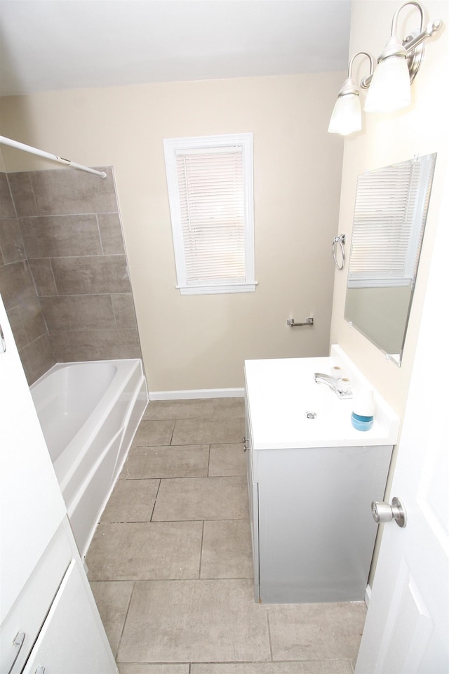 full bath featuring vanity, washtub / shower combination, and tile patterned floors