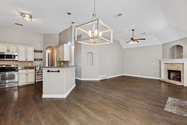 5376 Scarlet Ridge Dr, Arlington, TN 38002 - kitchen featuring backsplash, visible vents, ceiling fan with notable chandelier, open floor plan, and stainless steel appliances