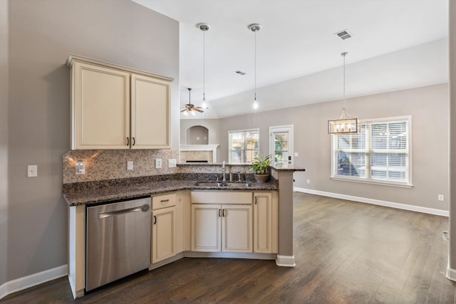 5376 Scarlet Ridge Dr, Arlington, TN 38002 - kitchen with stainless steel dishwasher, visible vents, cream cabinets, a sink, and vaulted ceiling