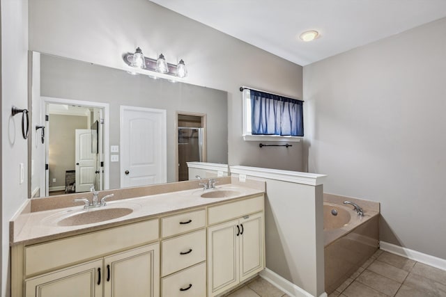 5376 Scarlet Ridge Dr, Arlington, TN 38002 - bathroom with tile patterned flooring, a sink, a bath, and double vanity