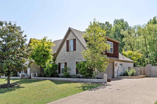 5376 Scarlet Ridge Dr, Arlington, TN 38002 - view of front of home featuring a garage, a front lawn, fence, a shingled roof, and driveway