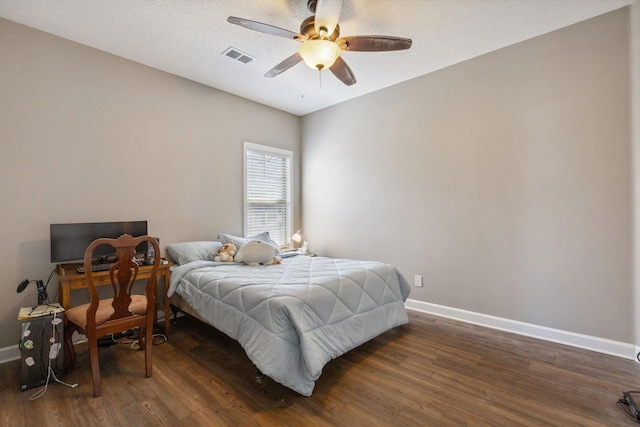 5376 Scarlet Ridge Dr, Arlington, TN 38002 - bedroom featuring baseboards, a ceiling fan, dark wood-style flooring, and visible vents