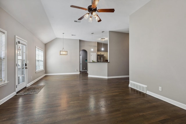 5376 Scarlet Ridge Dr, Arlington, TN 38002 - unfurnished living room featuring arched walkways, ceiling fan, vaulted ceiling, and visible vents