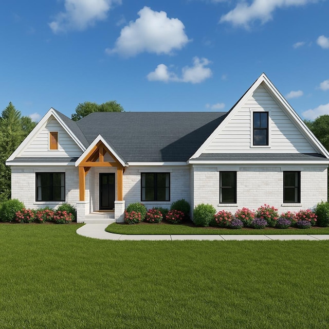 view of front of property featuring brick siding and a front yard