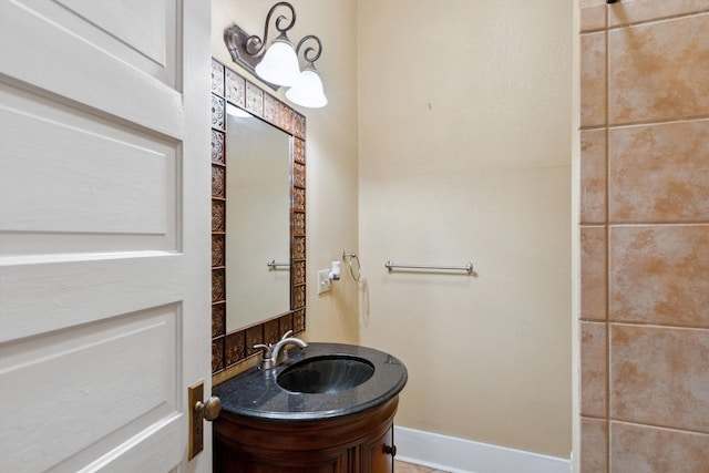 bathroom featuring vanity and baseboards