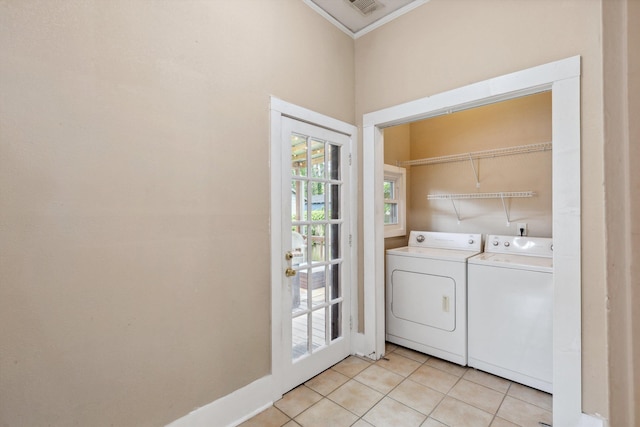 washroom with laundry area, crown molding, visible vents, washer and clothes dryer, and light tile patterned floors