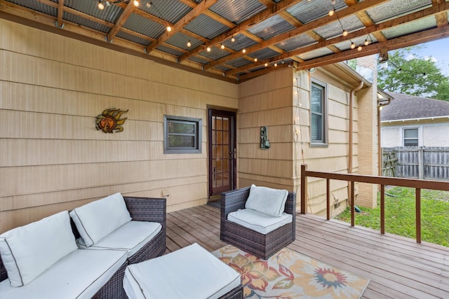wooden terrace with an outdoor hangout area