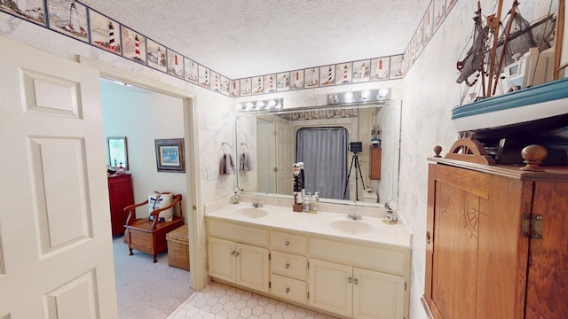 50 Red Oak Pt, Savannah, TN 38372 - full bathroom featuring double vanity, a sink, and a textured ceiling
