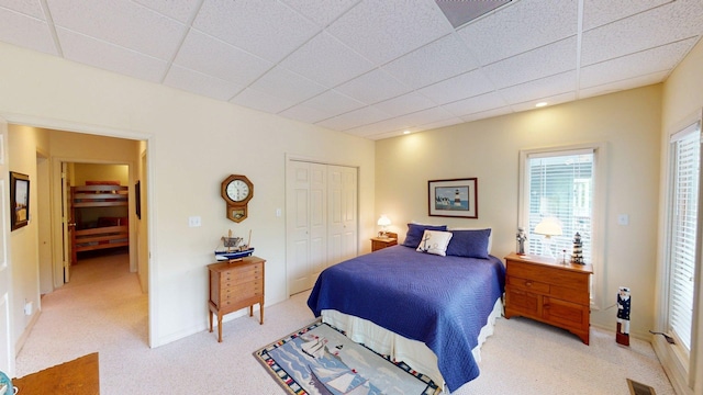 50 Red Oak Pt, Savannah, TN 38372 - bedroom featuring light carpet, a closet, a paneled ceiling, and visible vents