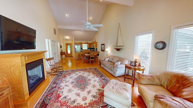 50 Red Oak Pt, Savannah, TN 38372 - living room with a fireplace, high vaulted ceiling, light wood-style flooring, a ceiling fan, and visible vents