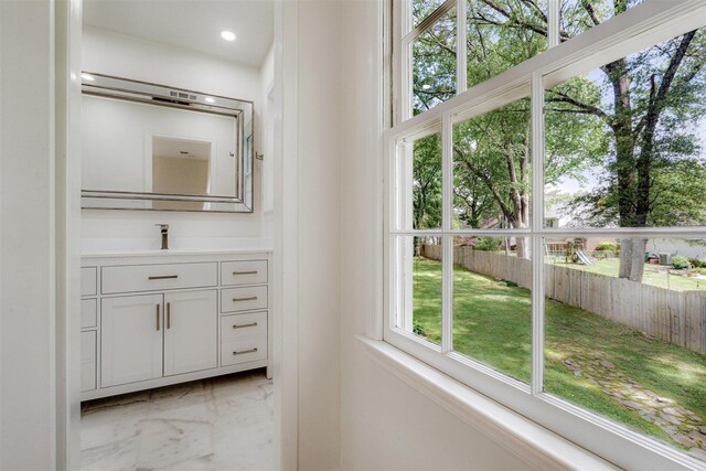 bathroom featuring vanity, recessed lighting, and marble finish floor