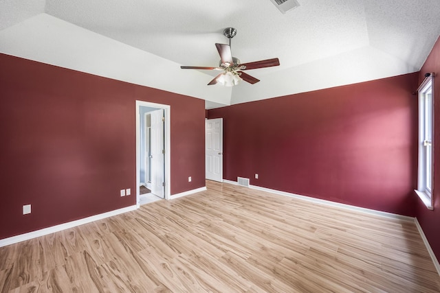 6747 Wild Ln, Bartlett, TN 38135 - unfurnished room featuring ceiling fan, visible vents, wood finished floors, and lofted ceiling