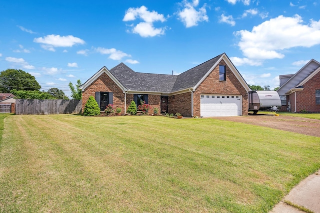 6747 Wild Ln, Bartlett, TN 38135 - view of front of house featuring brick siding, dirt driveway, a front lawn, and fence